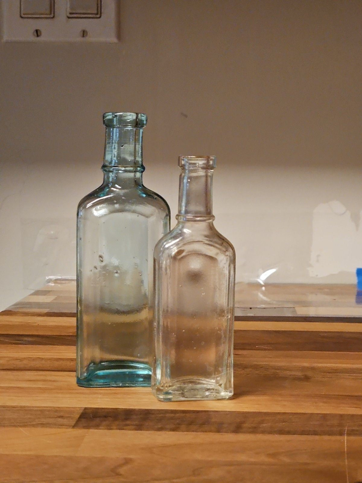 Set Of 2 Antique Medicine Bottles 5.5" & 4.75" Clear Aqua & Grey EUC