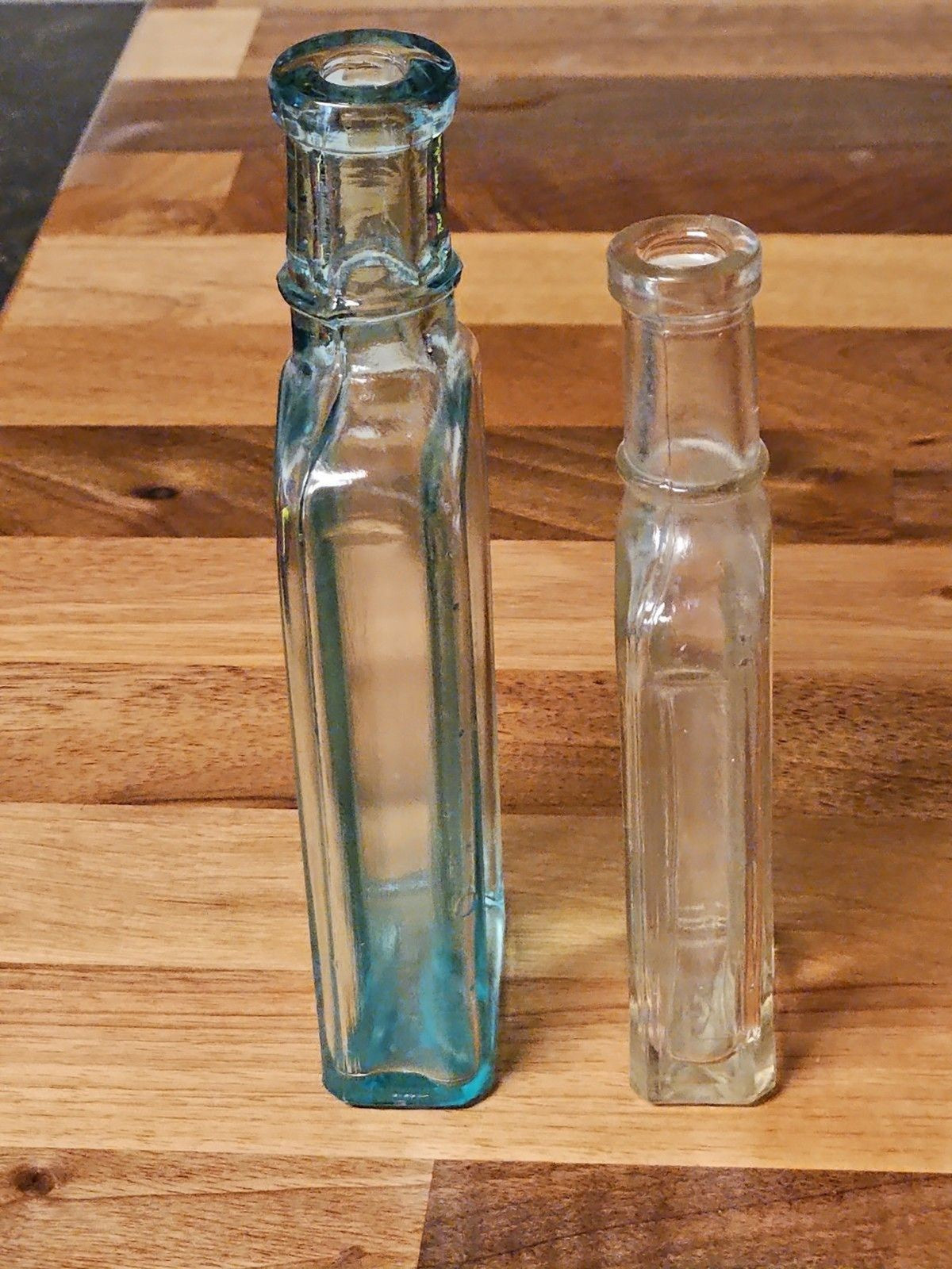 Set Of 2 Antique Medicine Bottles 5.5" & 4.75" Clear Aqua & Grey EUC