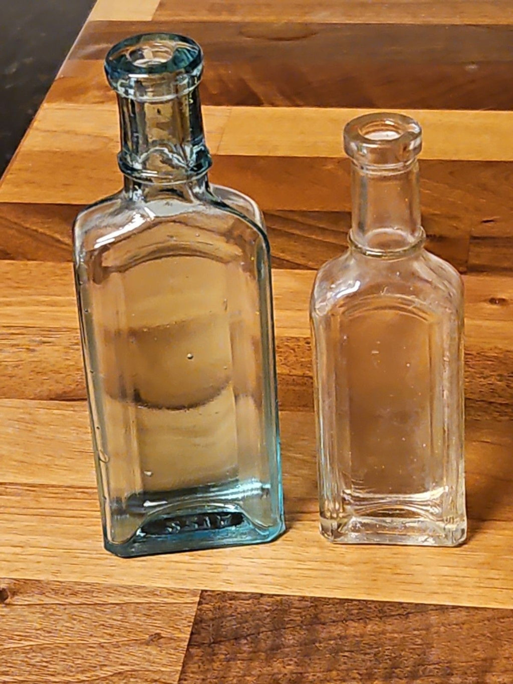 Set Of 2 Antique Medicine Bottles 5.5" & 4.75" Clear Aqua & Grey EUC
